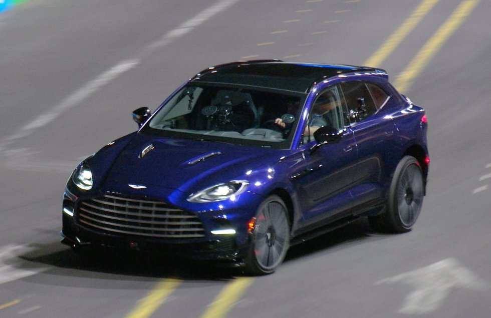 a blue car on a road